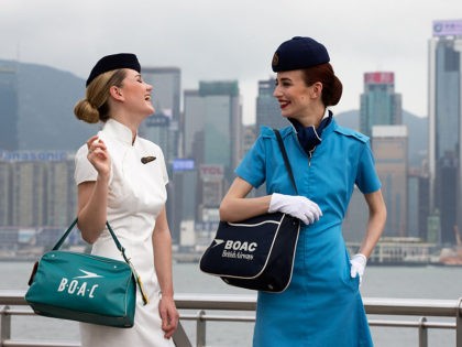 HONG KONG - APRIL 07: In this handout image provided by British Airways, Models Imogen Waterhouse and Lizzy Jagger take part in a British Airways heritage fashion shoot wearing BOAC (British Overseas Airways Company) uniforms in front of Hong Kong's iconic skyline to mark the 80th Anniversary of British Airways …