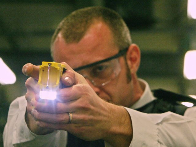 (FILES) A police officer trains using a taser gun at the Metropolitan Police Specialist Tr