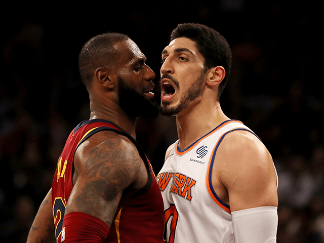 LeBron James #23 of the Cleveland Cavaliers and Enes Kanter #00 of the New York Knicks exc