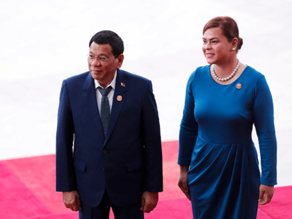 Philippine President Rodrigo Duterte (L) and his daughter Sara Duterte arrive for the open
