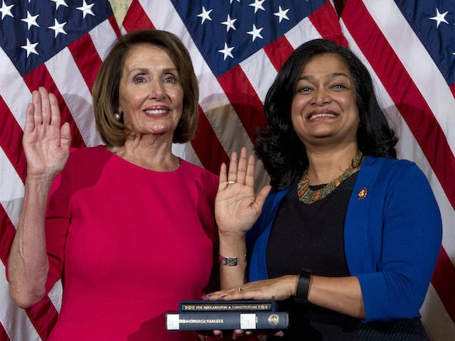 House Speaker Nancy Pelosi of Calif., administers the House oath of office to Rep. Pramila Jayapal (D-WA) during ceremonial swearing-in on Capitol Hill in Washington, January 3, 2019, during the opening session of the 116th Congress. (AP Photo/Jose Luis Magana)