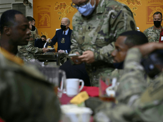 US President Joe Biden serves food to soldiers at Fort Bragg to mark the upcoming Thanksgi
