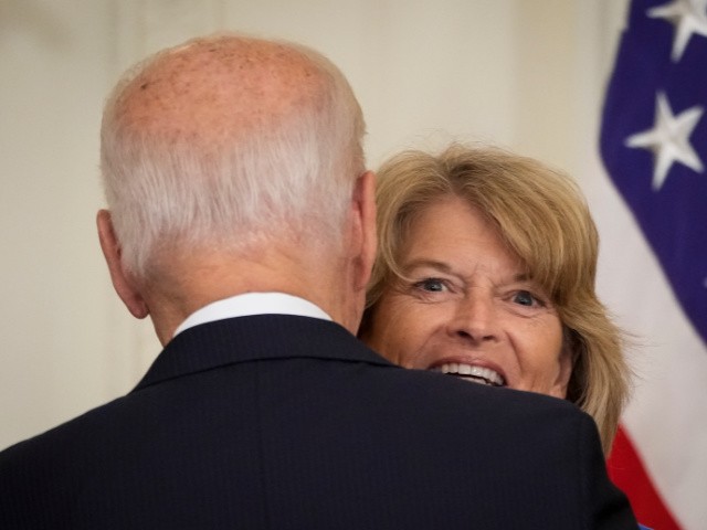 U.S. President Joe Biden talks with Sen. Lisa Murkowski (R-AK) after signing the VOCA Fix to Sustain the Crime Victims Fund Act of 2021 into law in the East Room of the White House on July 22, 2021 in Washington, DC. The law adds a new source of revenue for the Crime Victims Fund and makes changes to formula grants supported by the fund. (Photo by Drew Angerer/Getty Images)