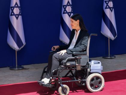 Israeli Minister of Energy Karine Elharrar arrives to the President's residence for an official photo with the new coalition government, in Jerusalem, on June 14, 2021. - A motley alliance of Israeli parties on June 13 ended Benjamin Netanyahu's 12 straight years as prime minister, as parliament voted in a …