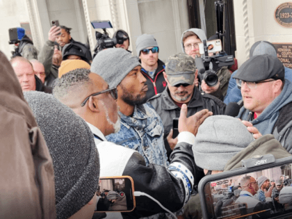Clyde McLemore confronts a Kyle Rittenhouse supporter outside the courthouse in Kenosha, WI, shortly after the jury delivered a not guilty verdict. (Photo: Randy Clark/Breitbart Texas)