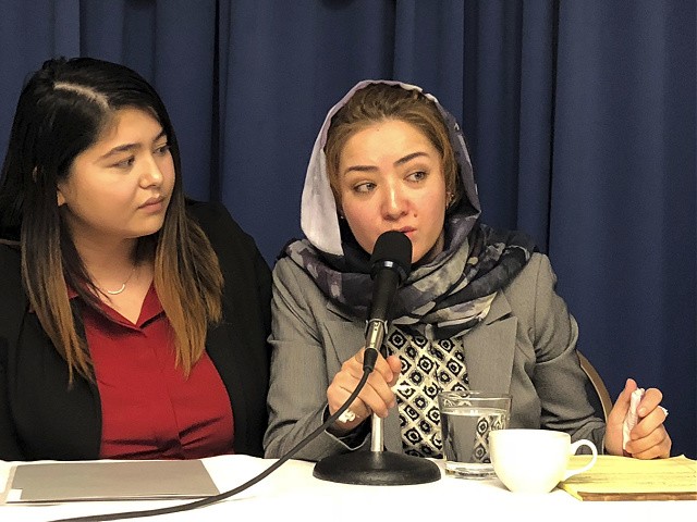 Mihrigul Tursun, right, speaks at a event at the National Press Club in Washington, Monday, Nov. 26, 2018. Tursun, a member of China’s Uighur minority is detailing the torture and abuse she suffered at the hands Chinese authorities as part of an escalating clampdown on hundreds of thousands of members of the country's Muslim minorities. Through a translator she said she spent several months in detention in China where she was beaten, tortured with electric shock and given unknown drugs. (AP Photo/Maria Danilova)