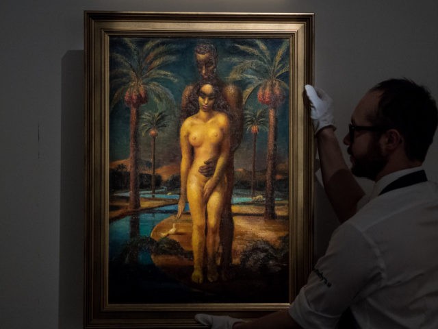 LONDON, ENGLAND - APRIL 20: A Sotheby's art handler poses with 'Adam and Eve' by Mahmoud Said during a press preview of Orientilist and Middle Eastern Art Week at Sotheby's on April 20, 2018 in London, England. The art week comprises of numerous works from Islamic Empires over three continents …