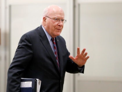 Sen. Patrick Leahy, D-Vt., waves as he arrives at the Capitol in Washington, Thursday, Jan. 30, 2020, during the impeachment trial of President Donald Trump on charges of abuse of power and obstruction of Congress. (AP Photo/Julio Cortez)