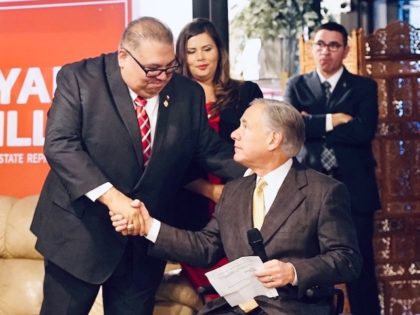 Texas State Rep. Ryan Guillen (R) shakes Gov. Greg Abbott's (R-TX) hand as Guillen announc