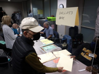 FAIRFAX, VIRGINIA - NOVEMBER 02: Virginia residents vote at the Fairfax County Government Center on November 02, 2021 in Fairfax, Virginia. Virginia and New Jersey hold off-year elections today in the first major elections since U.S. President Joe Biden victory in 2020. Virginia's gubernatorial race pits Republican candidate Glenn Youngkin …