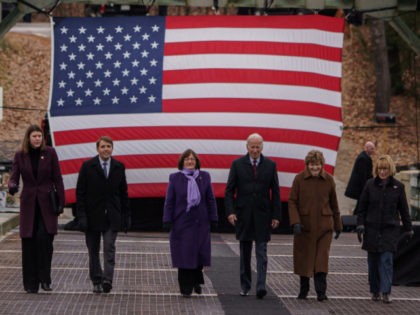 WOODSTOCK, NH - NOVEMBER 16: From left, Victoria Sheehan, Commissioner of the New Hampshire Department of Transportation, Rep. Chris Pappas (D-NH), Rep. Annie Kuster (D-NH), US President Joe Biden, U.S. Senator Jeanne Shaheen (D-NH), and U.S. Senator Maggie Hassan (D-NH) walk across the NH 175 bridge spanning the Pemigewasset River on …