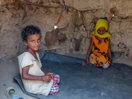 Displaced Yemeni children are pictured at a makeshift camp for people who fled fighting between Huthi rebels and the Saudi-backed government forces, in the village of Hays, near the conflict zone in Yemen's western province of Hodeida, on August 21, 2021. (Khaled Ziad/AFP via Getty Images)