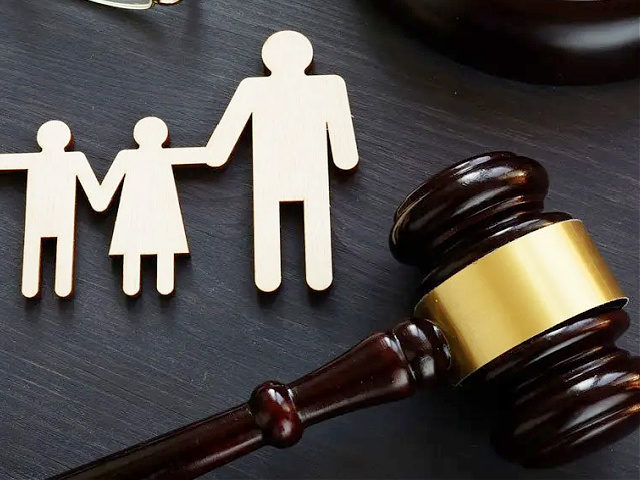 Family law concept. Figures and gavel. Adoption