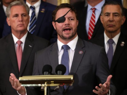 WASHINGTON, DC - AUGUST 31: U.S. Rep. Dan Crenshaw (R-TX) speaks as House Minority Leader Rep. Kevin McCarthy (R-CA) (L), Rep. Darrell Issa (R-CA) (R) and House Republican veterans of the military listen during a news conference at Rayburn Room of the U.S. Capitol August 31, 2021 in Washington, DC. …