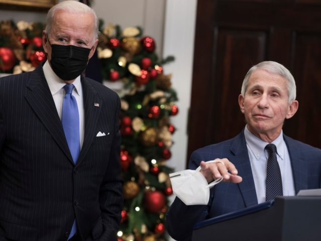 WASHINGTON, DC - NOVEMBER 29: Anthony Fauci (R), Director of the National Institute of Allergy and Infectious Diseases and Chief Medical Advisor to the President, speaks alongside U.S. President Joe Biden as he delivers remarks on the Omicron COVID-19 variant following a meeting of the COVID-19 response team at the …