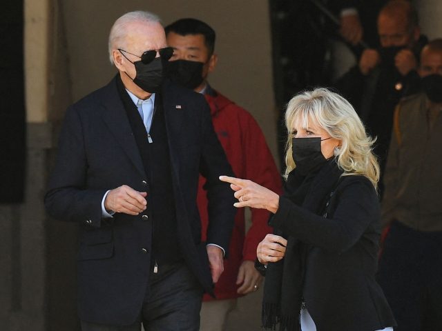 US President Joe Biden and First Lady Jill Biden make their way over to greet members of the Coast Guard at US Coast Guard Station Brant Point in Nantucket, Massachusetts on November 25, 2021. - Biden is in Nantucket to spend the Thanksgiving holiday. (Photo by MANDEL NGAN/AFP via Getty …
