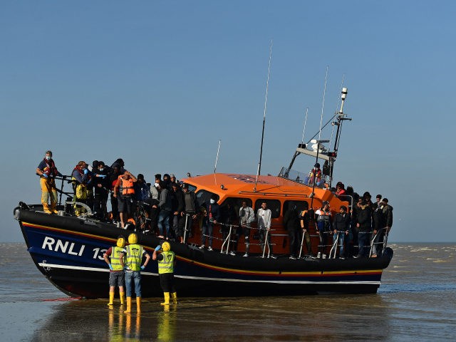 Migrants stand aboard an RNLI (Royal National Lifeboat Institution) lifeboat after being rescued crossing the English channel at a beach in Dungeness, southeast England on September 7, 2021. (Photo by Ben STANSALL / AFP) (Photo by BEN STANSALL/AFP via Getty Images)