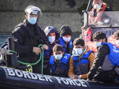 DOVER, ENGLAND - SEPTEMBER 09: Migrants are brought into Dover docks by Border Force staff on September 9, 2021 in Dover, England. Facing a continued rise in migrant arrivals across the English Channel, the British government has authorised its Border Force to turn back boats while at sea, in some …