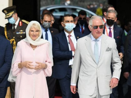 Egyptian Islamic scholar and the current Grand Imam of al-Azhar mosque, Sheikh Ahmed Al-Tayeb (L), receives Britain's Prince Charles (R), Prince of Wales, and Camilla (C), Duchess of Cornwall, upon their arrival at the mosque in Cairo on November 18, 2021. (Photo by Ahmed HASAN / AFP) (Photo by AHMED …