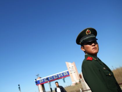 MANZHOULI, CHINA - AUGUST 28: A Chinese paramilitary officer stands guards at the Sino-Rus