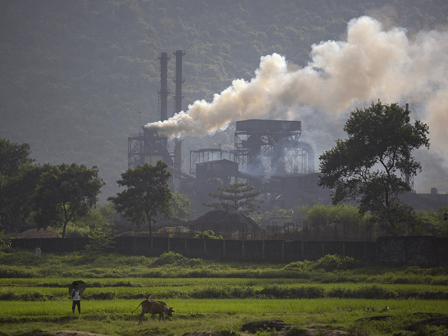 Smoke rises from a coal-powered steel plant at Hehal village near Ranchi, in eastern state of Jharkhand, Sunday, Sept. 26, 2021. No country will see energy needs grow faster in coming decades than India, and even under the most optimistic projections part of that demand will have to be met …