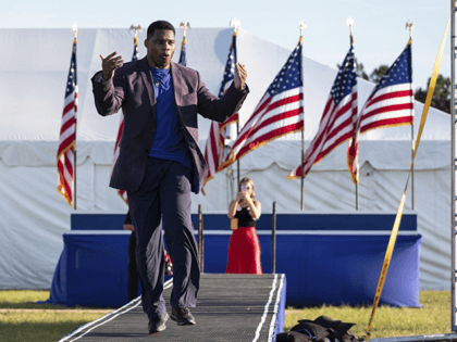 Senate candidate Herschel Walker takes the stage during former president Donald Trump's Save America rally in Perry, Ga., on Saturday, Sept. 25, 2021. Walker canceled a planned Texas fundraiser on Wednesday, Oct. 13 because an organizer was displaying a swastika made from syringes on social medial to protest mandatory vaccination. …