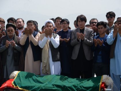 Afghan Shiite mourners offer funeral prayers for nine victims, who were killed in a suicide attack the previous day, in Kabul on August 16, 2018. - Gunmen launched an attack on an intelligence training centre in Kabul on August 16, officials said, just a day after a suicide bomber killed …