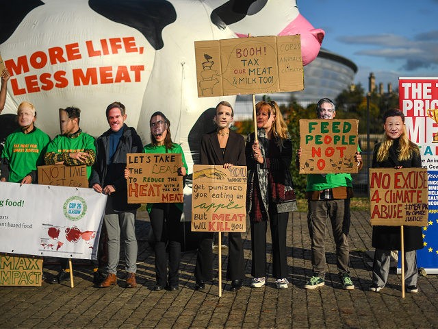 GLASGOW, SCOTLAND - NOVEMBER 03: Protesters are seen wearing masks of world leaders at an anti-meat protest outside the COP26 Summit on November 3, 2021 in Glasgow, United Kingdom. As World Leaders meet to discuss climate change at the COP26 Summit, many climate action groups have taken to the streets …