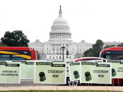 WASHINGTON, DC - OCTOBER 13: Immigrants install hundreds of green card placards symbolizing their demand for U.S. citizenship in front of the U.S. Capitol Building on October 13, 2021 in Washington, DC. (Photo by Paul Morigi/Getty Images for Communities United for Status and Protection)