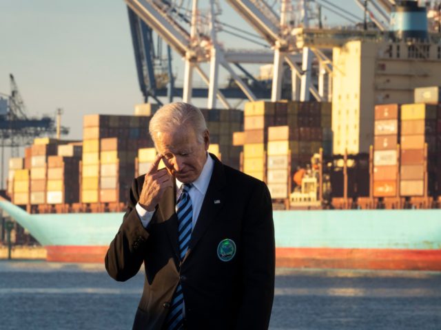 BALTIMORE, MD - NOVEMBER 10: U.S. President Joe Biden waits to speak about the recently passed $1.2 trillion Infrastructure Investment and Jobs Act at the Port of Baltimore on November 10, 2021 in Baltimore, Maryland. President Biden will sign the bill next week, where he plans to bring Democrats and …