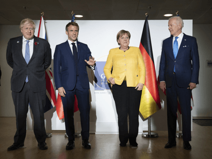 From left, British Prime Minister Boris Johnson, French President Emmanuel Macron, German Chancellor Angela Merkel and U.S. President Joe Biden at the G20 summit in Rome, Saturday, Oct. 30, 2021. The two-day Group of 20 summit is the first in-person gathering of leaders of the world's biggest economies since the …