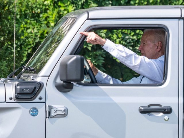 US President Joe Biden drives a Jeep Wrangler Rubicon 4xe after delivering remarks on the