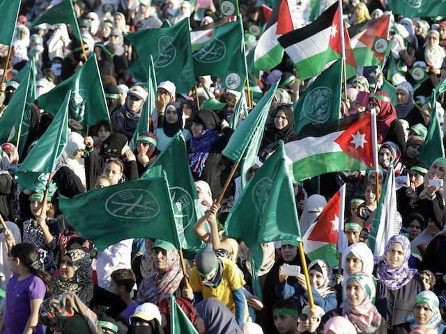 Jordanian supporters of the Muslim Brotherhood gather during a protest to celebrate the "Gaza victory" in the war against Israel, in the capital Amman on August 8, 2014. (Khalil Mazraawi/AFP via Getty Images)