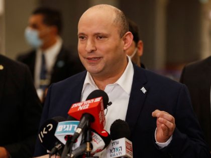 Israeli Prime Minister Naftali Bennett speaks to reporters following a session at the Knesset (Israeli parliament), in Jerusalem on November 4, 2021. - Israeli lawmakers passed the country's first state budget in three years, in a victory for the disparate governing coalition, ahead of a key vote on a 2022 …
