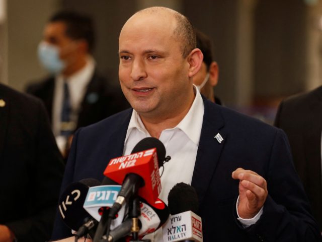 Israeli Prime Minister Naftali Bennett speaks to reporters following a session at the Knes