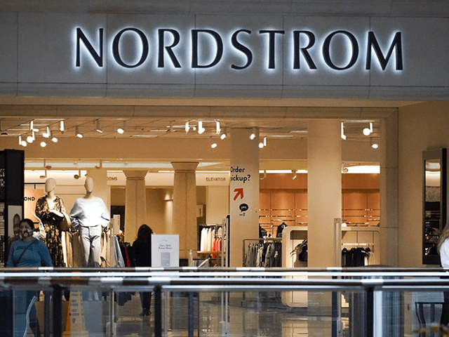 Shoppers walk near an entrance to a Nordstrom store at a shopping mall in Pittsburgh on Wednesday, Feb. 24, 2021. Nordstrom says it's acquiring a minority interest in four fashion brands owned by a British company called Asos as the department store aims to reach out to younger customers. The …