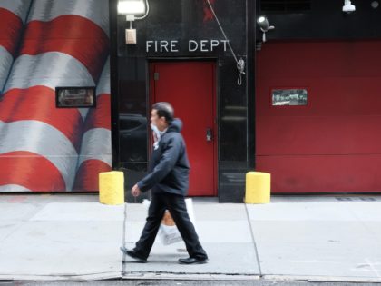 NEW YORK, NEW YORK - NOVEMBER 01: People walk by a fire house as New York City mayoral can