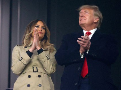ATLANTA, GEORGIA - OCTOBER 30: Former first lady and president of the United States Melania and Donald Trump look on during Game Four of the World Series between the Houston Astros and the Atlanta Braves Truist Park on October 30, 2021 in Atlanta, Georgia. (Photo by Elsa/Getty Images)