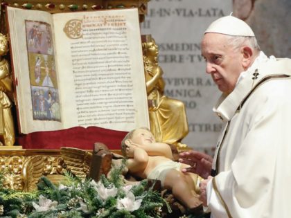 Pope Francis blesses a statuette of the Christ Child as he celebrates Mass for the Epiphany on January 6, 2021 at St. Peter's Basilica in the Vatican. (Photo by Remo CASILLI / POOL / AFP) (Photo by REMO CASILLI/POOL/AFP via Getty Images)