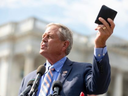 Rep. Ralph Norman, R-S.C., holds up his wallet while discussing the cost of the infrastructure bill making its way through congress during a news conference held by the House Freedom Caucus on Capitol Hill in Washington, Monday, Aug. 23, 2021. (AP Photo/Amanda Andrade-Rhoades)