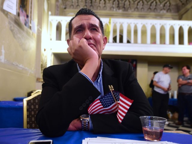 OPSHOT - An emotional Gerardo Ruiz watches the Election results from the headquarters of US Democratic presidential Hillary Clinton in East Los Angeles on November 8, 2016. / AFP / Frederic J. BROWN (Photo credit should read FREDERIC J. BROWN/AFP via Getty Images)
