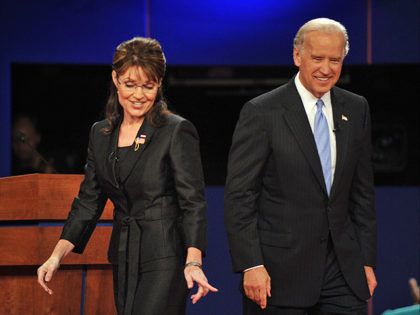 Republican Sarah Palin (L) and Democrat Joseph Biden (R) walk on stage following their vic