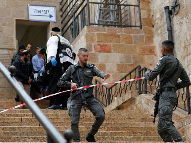 EDITORS NOTE: Graphic content / Israeli security forces clear the way for first responders