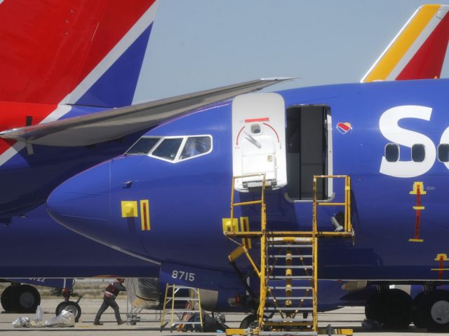 VICTORVILLE, CA - MARCH 27: A worker walks beneath a Southwest Airlines Boeing 737 MAX 8 a