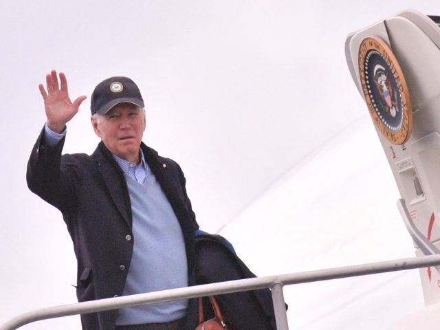 US President Joe Biden waves before boarding Air Force One before departing from Nantucket Memorial Airport in Nantucket, Massachusetts on November 28, 2021. (Photo by MANDEL NGAN / AFP) (Photo by MANDEL NGAN/AFP via Getty Images)