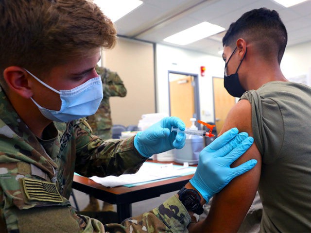 Army Spc. Tyler Boyer administers the COVID-19 vaccine to another soldier at Fort Carson, Colo., Aug 3, 2021. Soldiers remain committed to keeping the Fort Carson community safe and healthy by offering COVID-19 vaccines at mobile vaccination centers. U.S. Army photo by Sgt. Andrew Greenwood