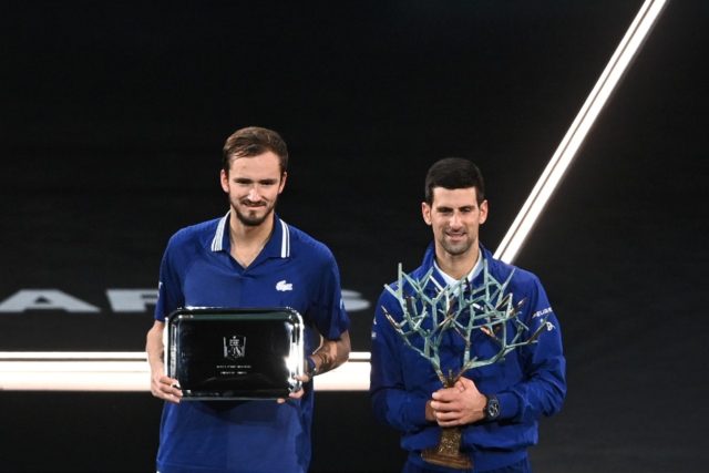 Tennis world number one Novak Djokovic (R) is gaining respect for his record-breaking achi