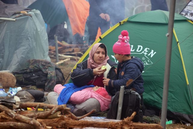 The migrants, mainly from the Middle East, have spent days in freezing temperatures on the