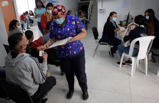 Venezuelan migrants wait to be inoculated against Covid-19 with the Johnson & Johnson