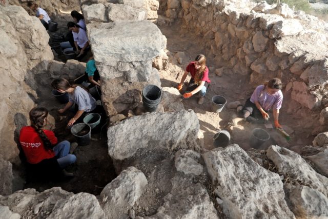 High school students take part in the excavation of ruins of a Hellenistic fortified struc